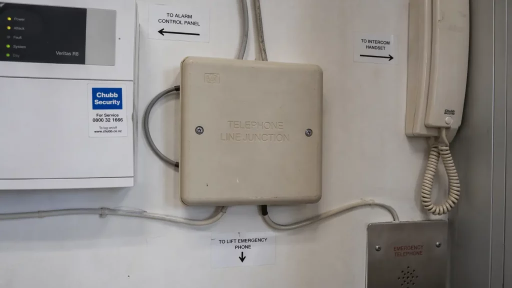 A single legacy phone line carrying multiple business services including alarms and intercoms